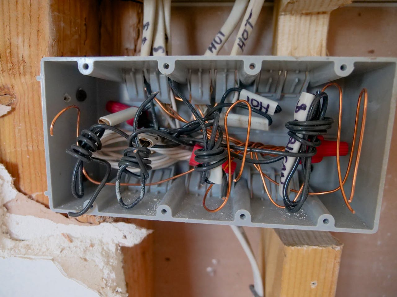 The Art of Drawing Readers In: Your attractive post title goes here Detailed view of an open electrical switchboard with tangled wires and cables.